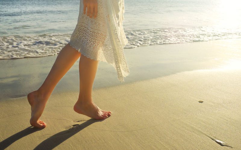 Woman walking on the beach